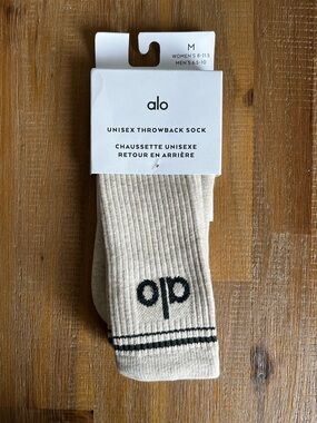 ALO Yoga Unisex Throwback Ribbed Socks in Cream with Black Logo